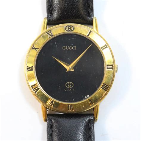 gucci mens 18kt gold watch with black leather band